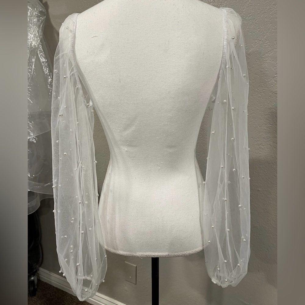 Removable sheer sleeves with pearls